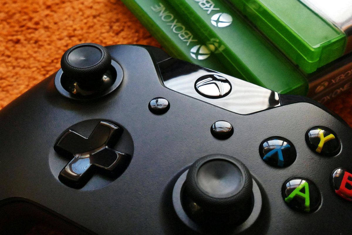 Xbox controller next to games