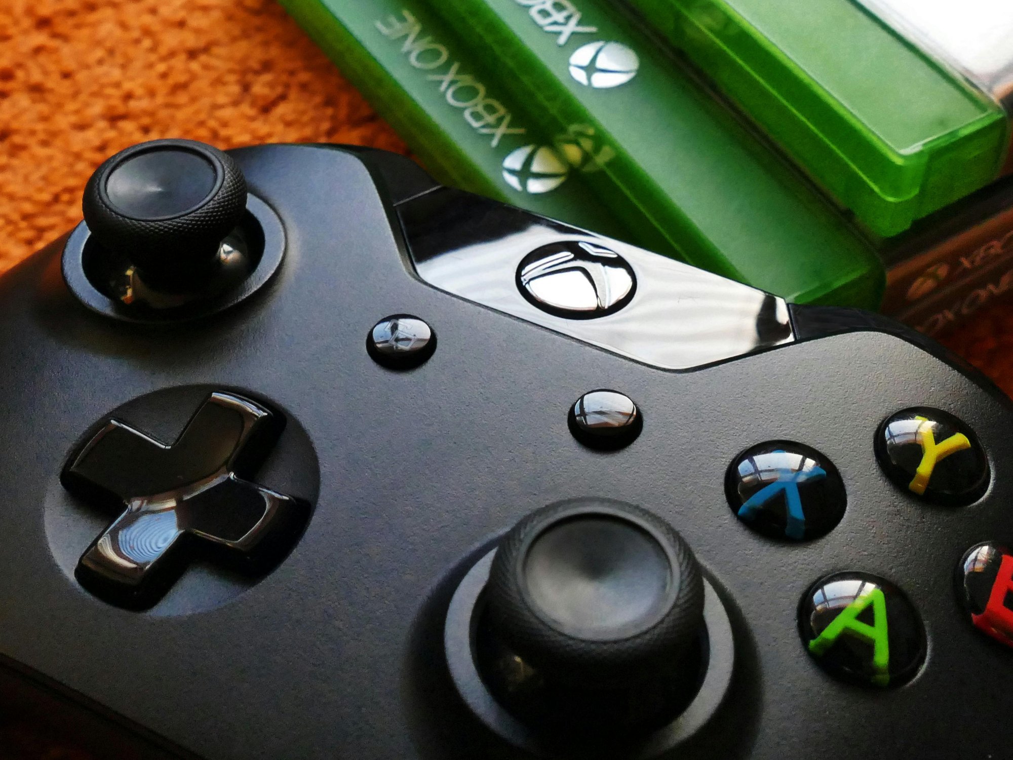 Xbox controller next to games