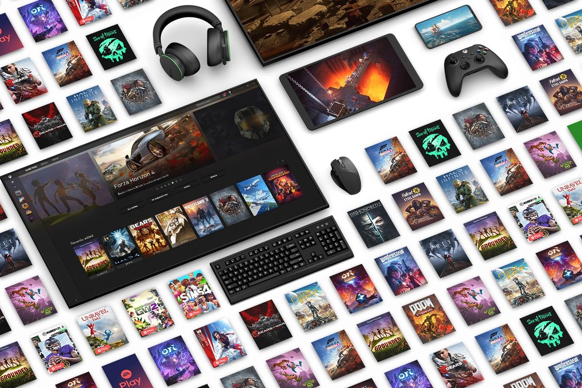 xbox video games computer keyboard and xbox wireless controllers laid out in a tiled pattern