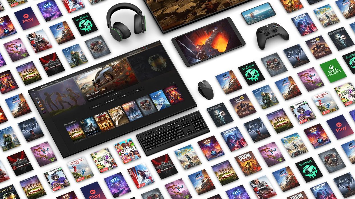 xbox video games computer keyboard and xbox wireless controllers laid out in a tiled pattern