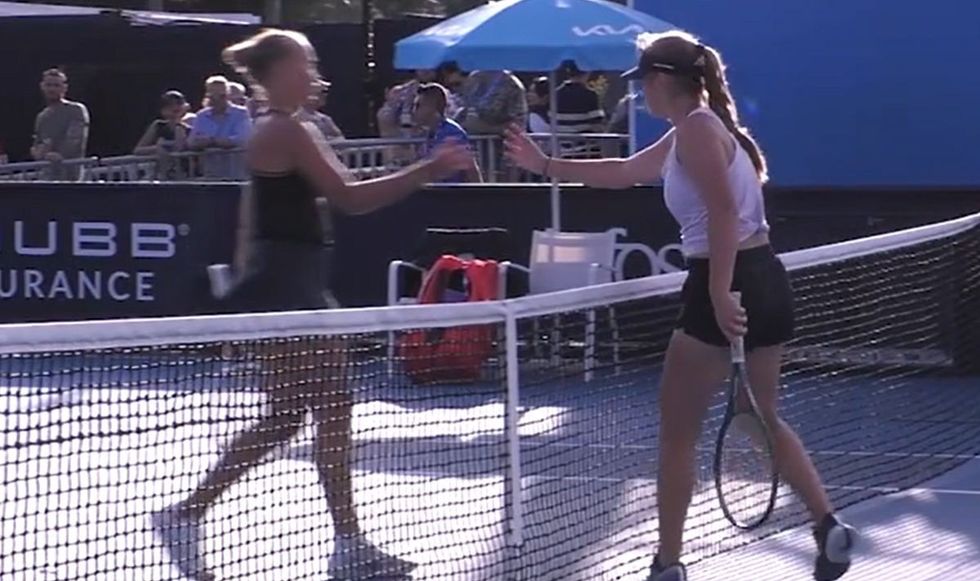 Yelyzaveta Kotliar (left) shook hands with her Russian opponent