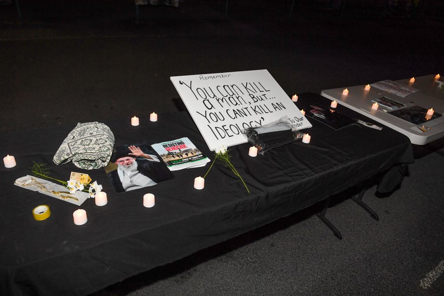 'You can kill a man but you can\u2019t kill an ideology' sign on table commemorating deceased Iranian leader