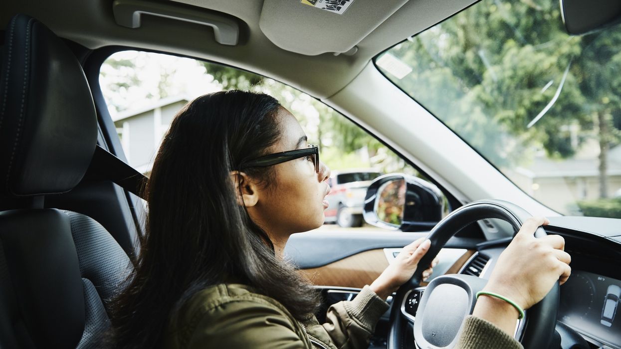 Young driver in vehicle