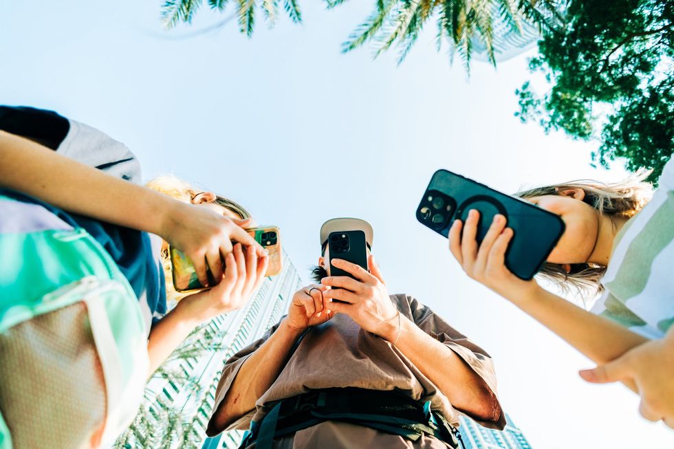 Young people on phones outide