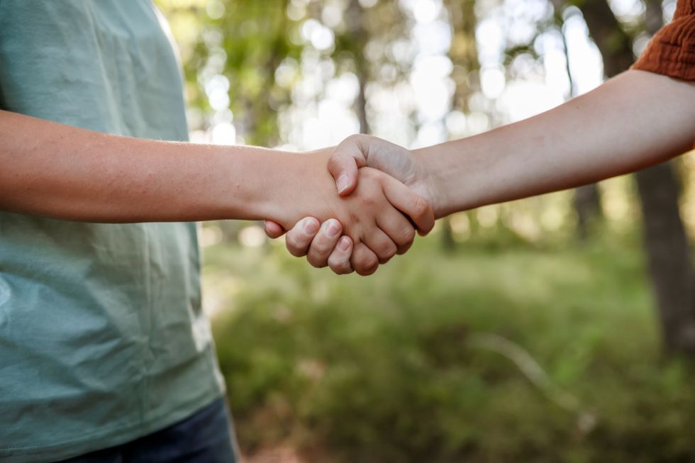 Young people shaking hands