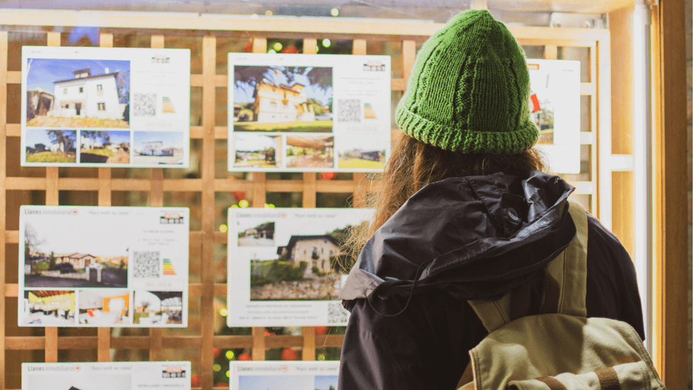 Young person looking at houses