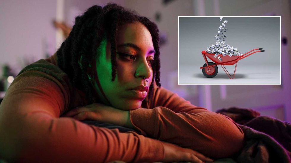 Young person looking sad and cash wheel-barrow