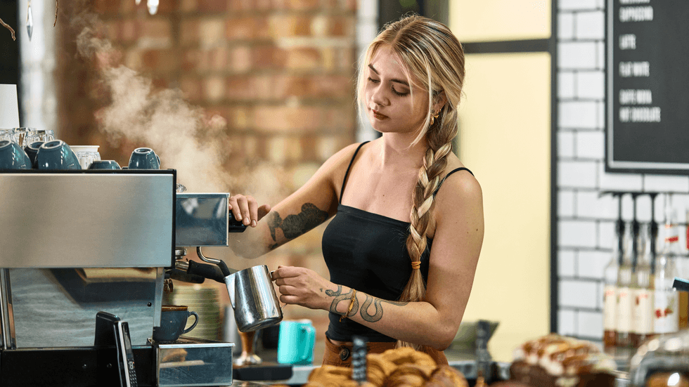 Young person working in a coffee shop