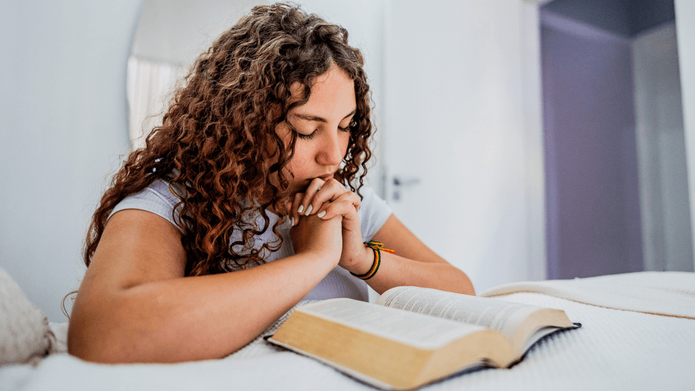 Young woman reading the Bible