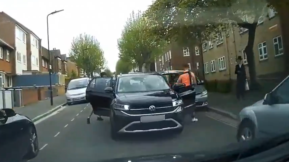 Youths in car and Jewish man