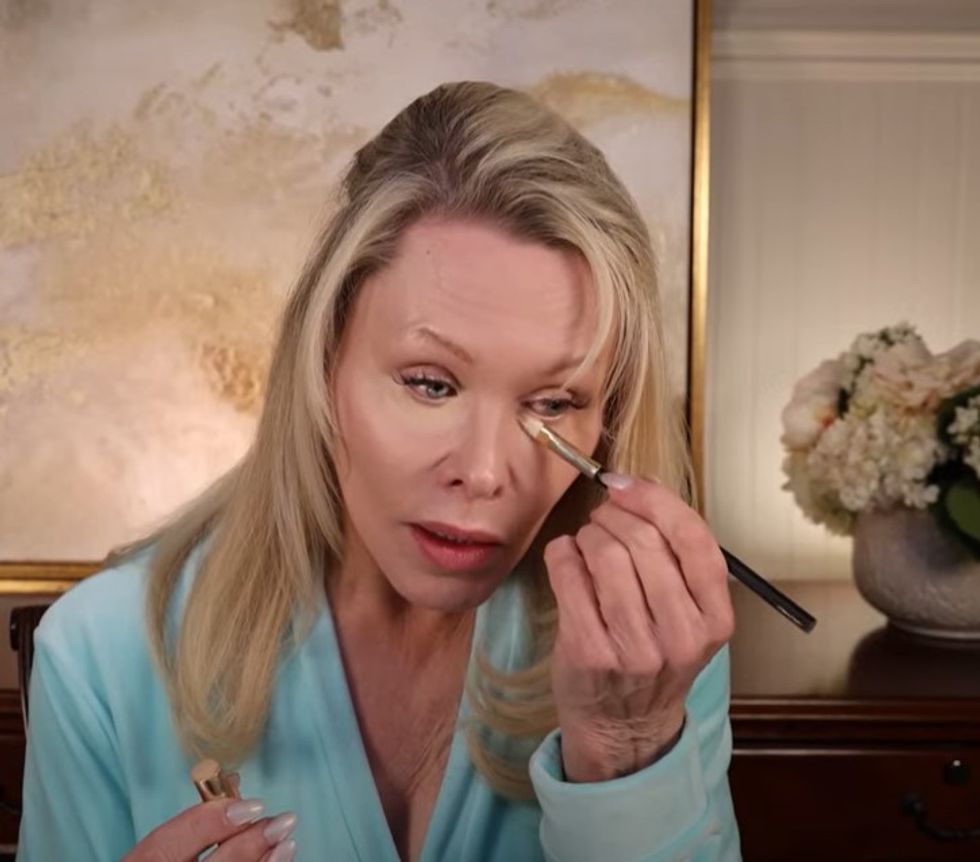 YouTube creator NewAgeBeauty applying concealer