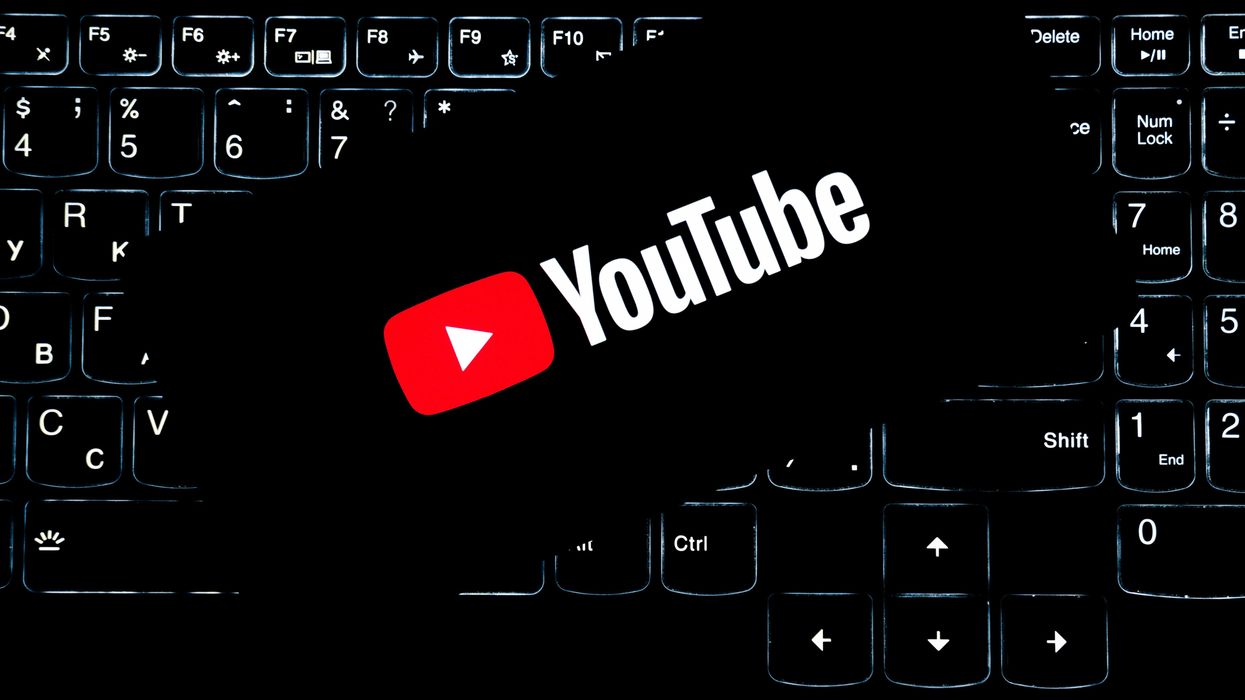 YouTube logo on smart phone with keyboard background