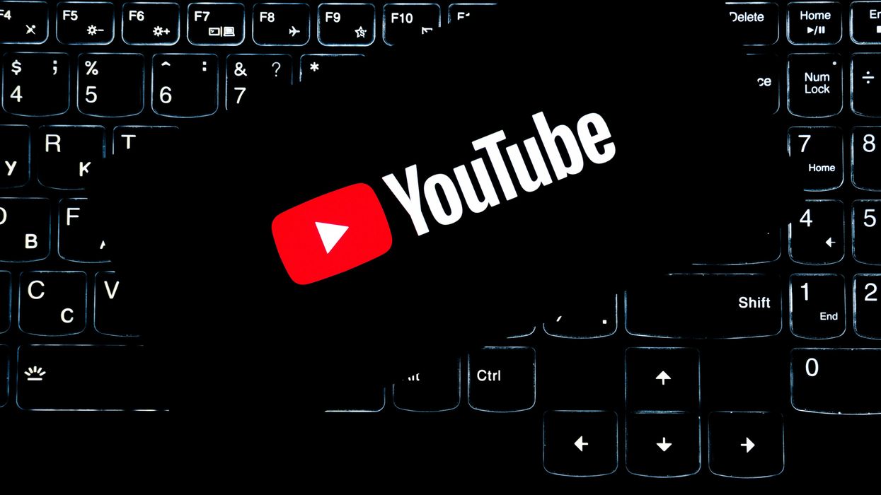 YouTube logo on smart phone with keyboard background