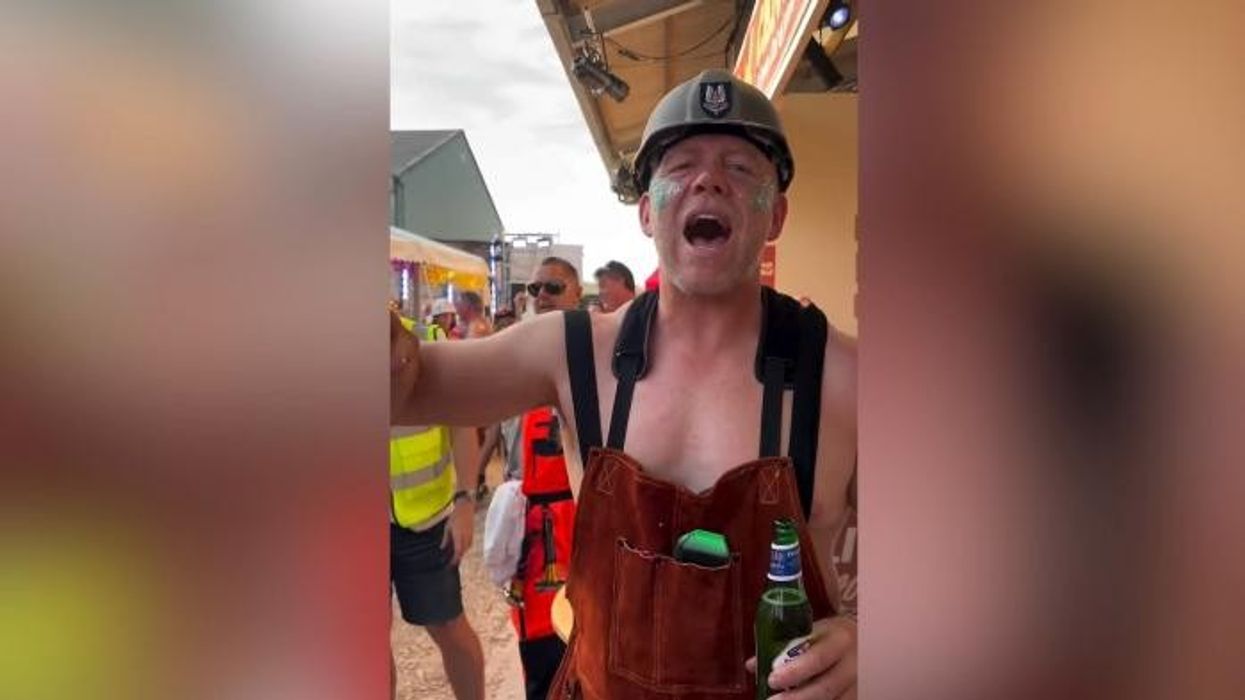 Zara Tindall lets loose with topless Mike Tindall at wild private festival