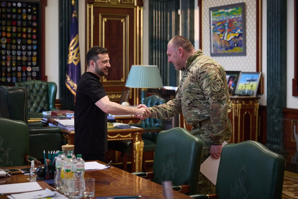 Zelensky and Maliuk shake hands