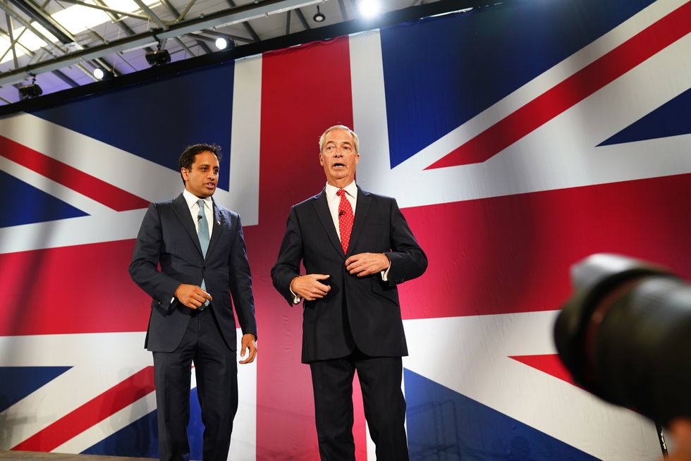 Zia Yusuf and Nigel Farage in front of a large Union Jack