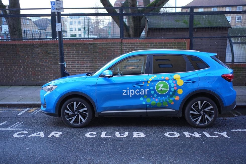 Zipcar electric vehicle parked in a car club parking space