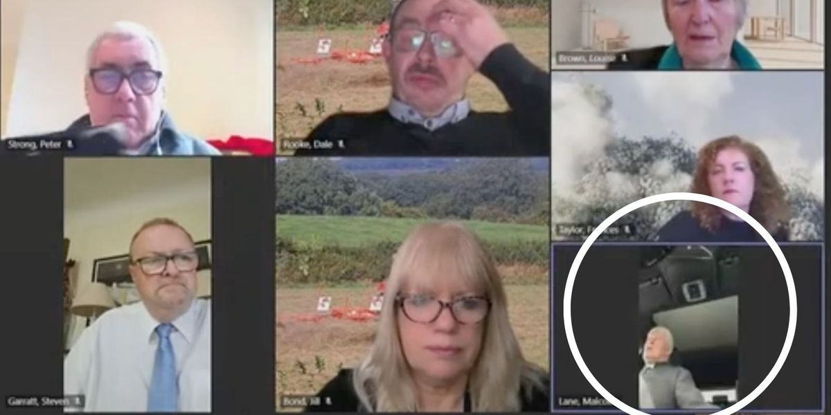 NextImg:Priest joins council Zoom meeting while driving to funeral
